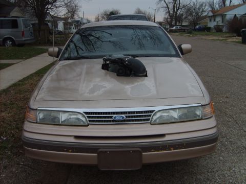 1993 Ford Crown Victoria - This 1993 Ford Crown Victoria features a prominent engine intake protruding through the hood.