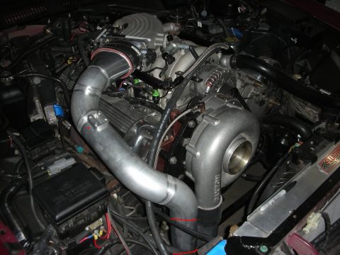 1992 Ford Crown Victoria - Custom turbocharger and intercooler piping installed in an engine bay.