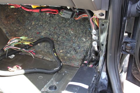 2007 Ford Crown Victoria - use this area pictured at the end of the wiring runner where the kick panel would go, for the ground wire 57 (BK) and tap into power from t…