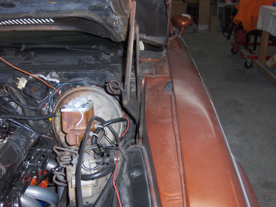 1980 Chevrolet Camaro engine bay showing brake booster and wiring