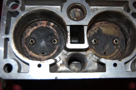 1994 Ford Bronco - This image shows the intake ports of an engine cylinder head with visible carbon deposits on the valves.