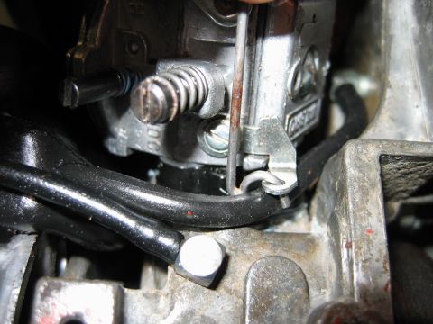 1992 Ford Bronco - Carburetor adjustment in progress, showing internal components and wiring.