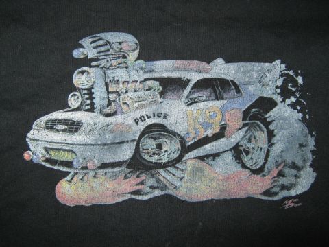 2000 Mercury Grand Marquis - A stylized drawing depicts a heavily modified police car with an oversized engine and flames.