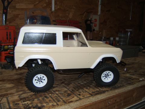 1988 Ford Bronco - RC crawler model resembling a first-generation Ford Bronco sits on a wooden surface.