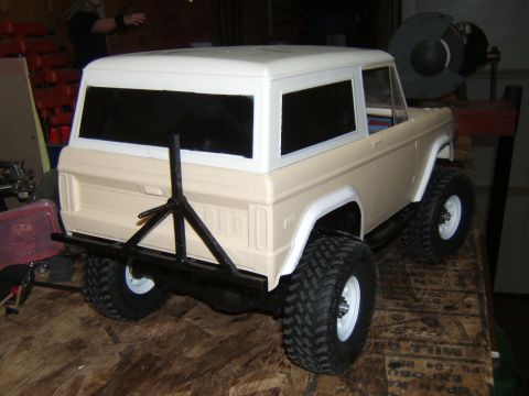 1988 Ford Bronco - This is a model of an older SUV, possibly a Bronco, with large off-road tires and a rear-mounted spare tire carrier.