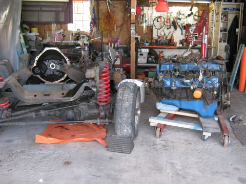 1977 Ford F-150 - A garage scene shows a vehicle's chassis and a disassembled engine, suggesting a repair or restoration project.
