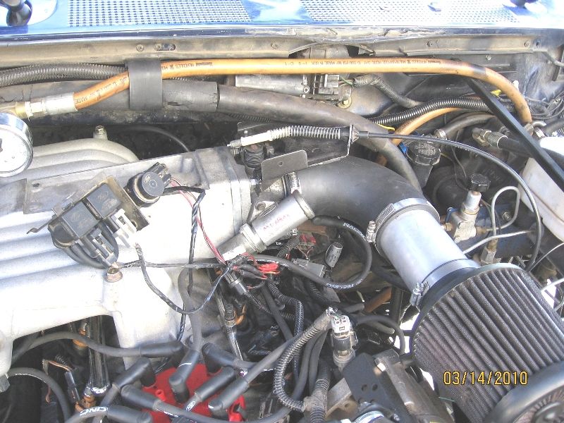 Ford V8 engine bay with cone air filter, aluminum intake tube and polished intake