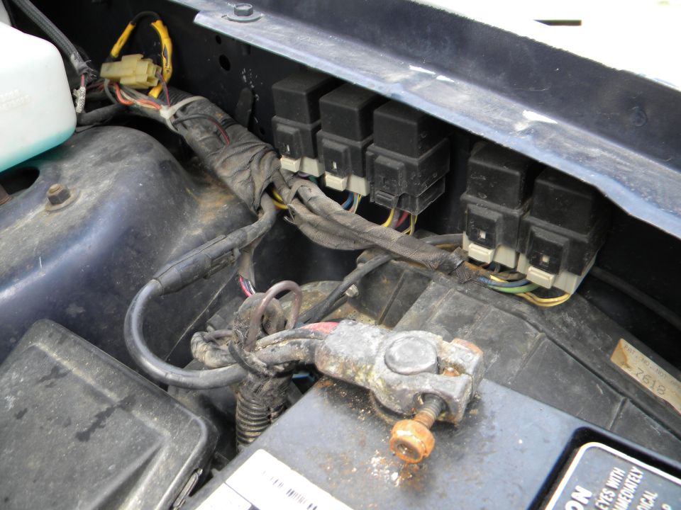 Car battery terminal with corroded clamp and wiring harness with multiple relays