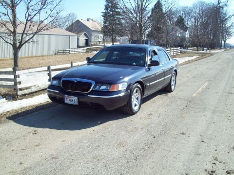 1999 Mercury Grand Marquis - This 1999 Mercury Grand Marquis is seen from a 3q-front angle on a rural road.