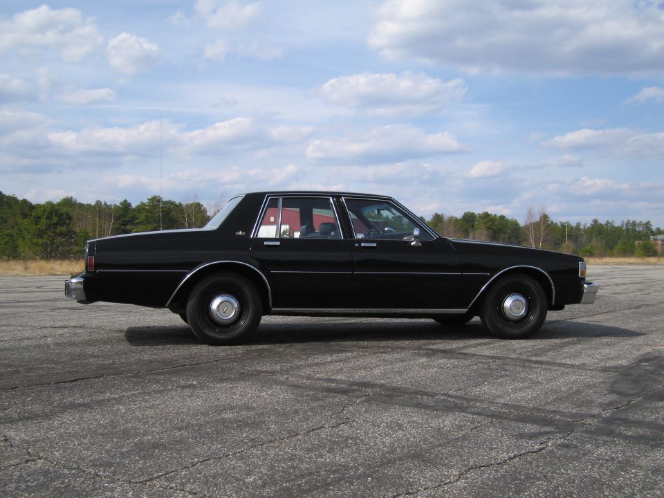 Black sedan side view