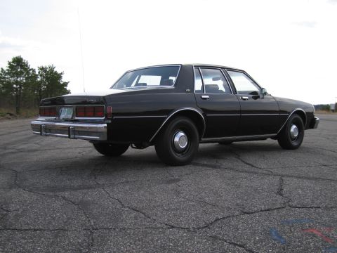 1991 Ford LTD Crown Victoria - This black sedan's body style suggests a 1980s model, not a 1991 Ford Crown Victoria LTD.