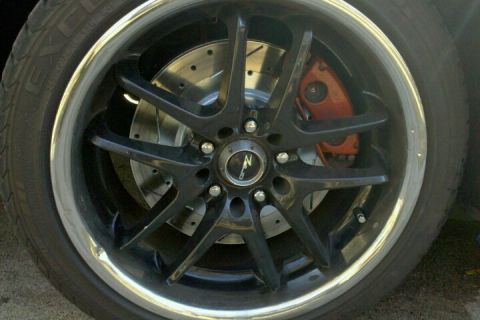 1992 Ford Bronco - Custom black five-spoke wheel with an orange brake caliper and slotted rotor is visible.