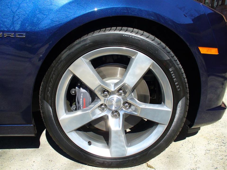 Blue 2010 Chevrolet Camaro front wheel with Brembo brakes and Pirelli tire