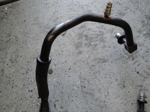 1989 Ford Taurus - This is a close-up of an automotive AC hose, likely for an engine swap project.