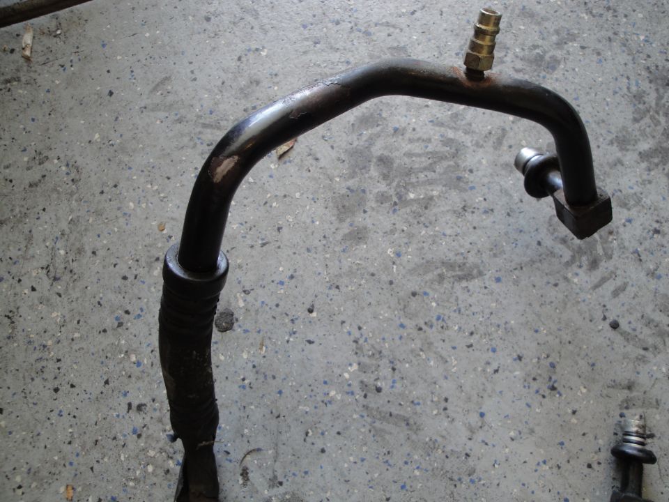Automotive AC hose with a brass fitting and a square end fitting