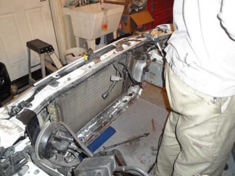 1989 Ford Taurus - The radiator and surrounding components are visible in the engine bay of a 1989 Ford Taurus, suggesting repair or modification work.