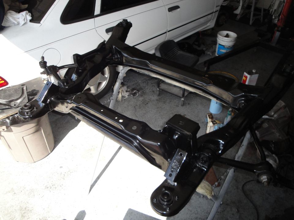 Black front subframe assembly with suspension components