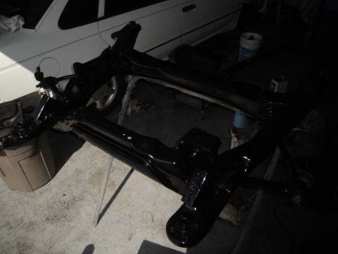 1989 Ford Taurus - Car subframe assembly, likely for a front-wheel-drive vehicle, is shown after being painted.