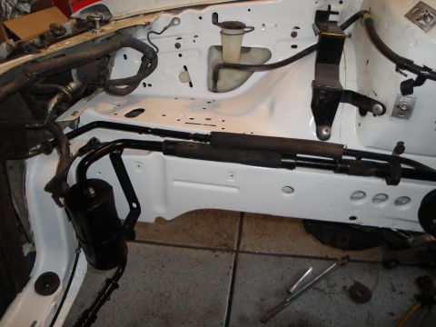 1989 Ford Taurus - Close-up view of the engine bay, showing various mechanical parts and wiring harnesses.