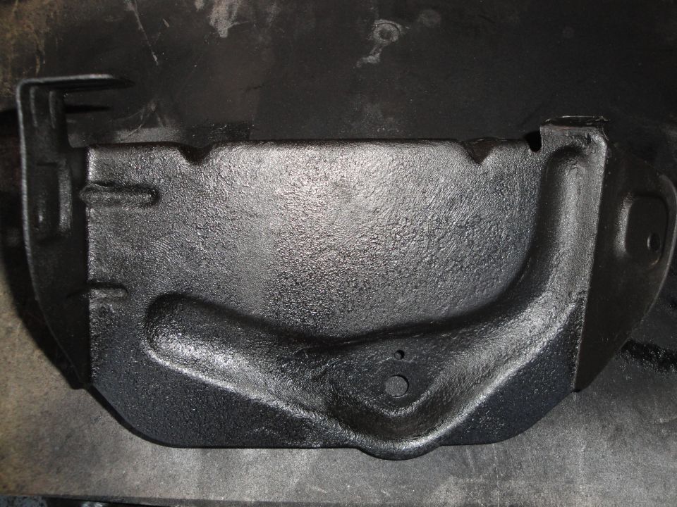 black metal engine oil pan, looks like it's been recently painted