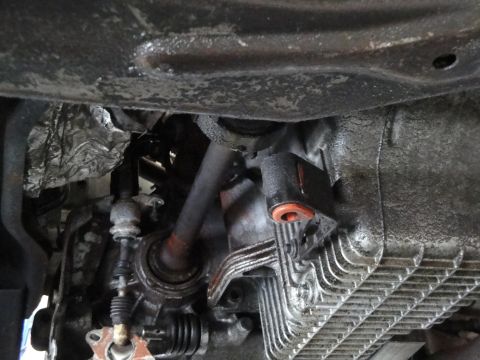 1989 Ford Taurus - This photo shows the underside of a vehicle, focusing on the transmission and related components.