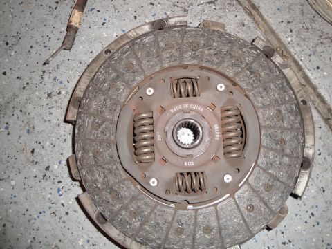 1989 Ford Taurus - A worn clutch disc is shown, with "MADE IN CHINA" stamped on the center hub.