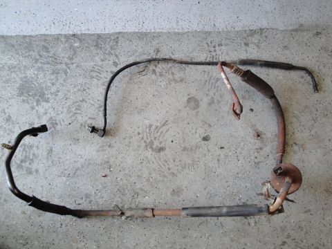 1989 Ford Taurus - This is an exhaust pipe assembly with a sensor, likely removed from a vehicle for replacement or repair.