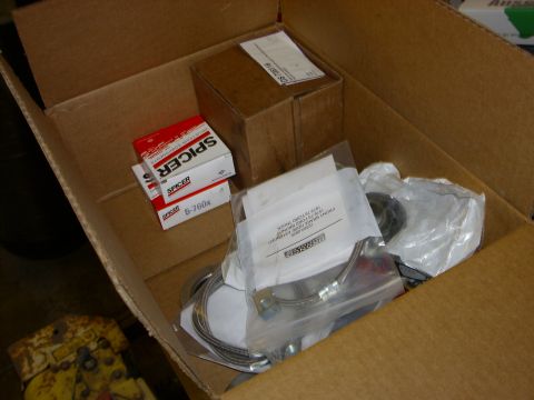 1995 Ford F-150 - Box of Spicer parts, including a brake hose, for a 1973-1979 Ford truck.