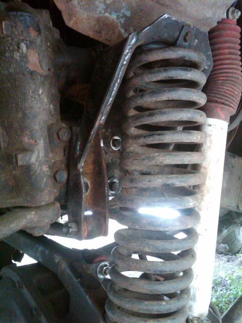 1978 Ford Bronco - I spliced the cut side of the coil bucket to the track bar bracket with a chunk I cut out of the old coil bucket.