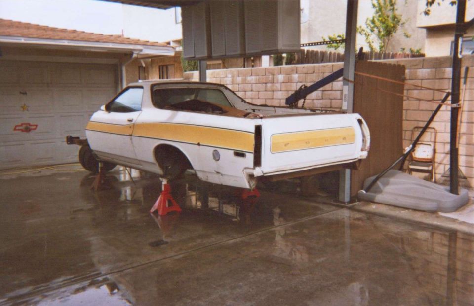1972 Ford Ranchero rear view on jack stands, white with yellow stripe