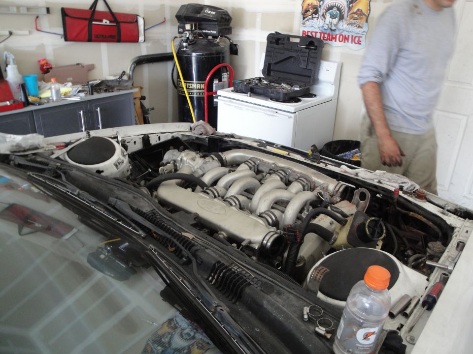 1989 Ford Taurus engine bay, V-shaped intake manifold visible
