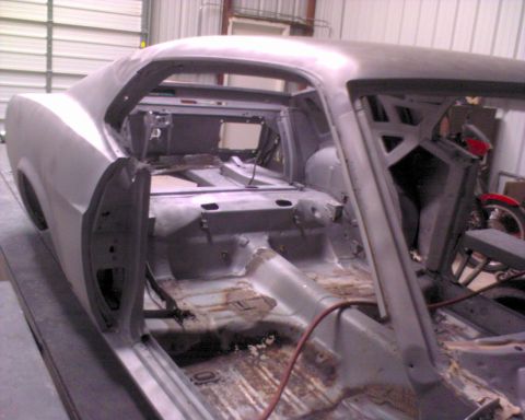 1970 Ford Mustang - This 1970 Ford Mustang is undergoing restoration, with its interior completely stripped to reveal the bare metal body shell.