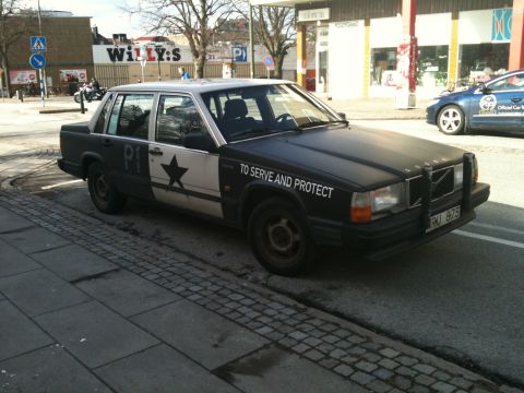 1998 Ford Crown Victoria - This Volvo 740/760 sedan is modified to resemble a police vehicle, complete with markings and a push bar.