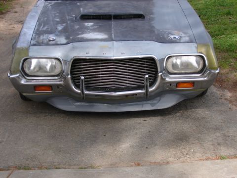 1973 Ford Ranchero - Front view of a 1973 Ford Ranchero, showing its distinctive grille and hood scoop.