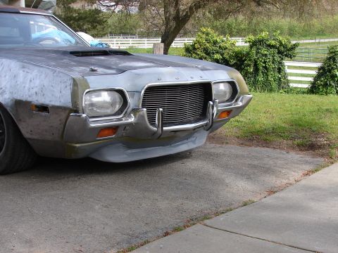 1973 Ford Ranchero - Front view of a 1973 Ford Ranchero, showing its distinctive chrome grille and headlight assembly.
