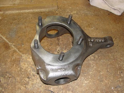 1995 Ford Bronco - Close-up of a metal automotive part with stamped numbers, likely a component for a vehicle's suspension or drivetrain.