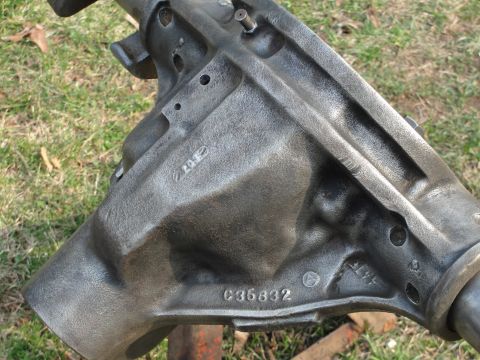 1995 Ford Bronco - A close-up view of a cast iron differential housing, showing cast-in numbers and markings.