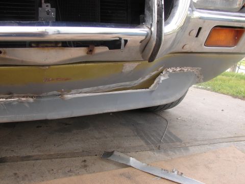 1973 Ford Ranchero - The front bumper of a vehicle shows significant damage and has been prepped for repair.