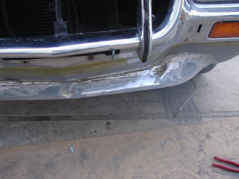 1973 Ford Ranchero - Front bumper of a 1973 Ford Ranchero shows damage and primer, indicating repair work.