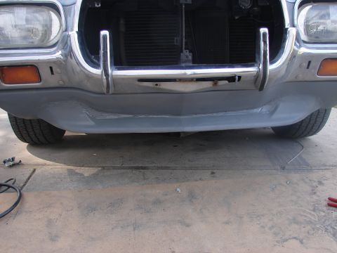 1973 Ford Ranchero - Front view of a 1973 Ford Ranchero undergoing bodywork, showing the bumper and grille.