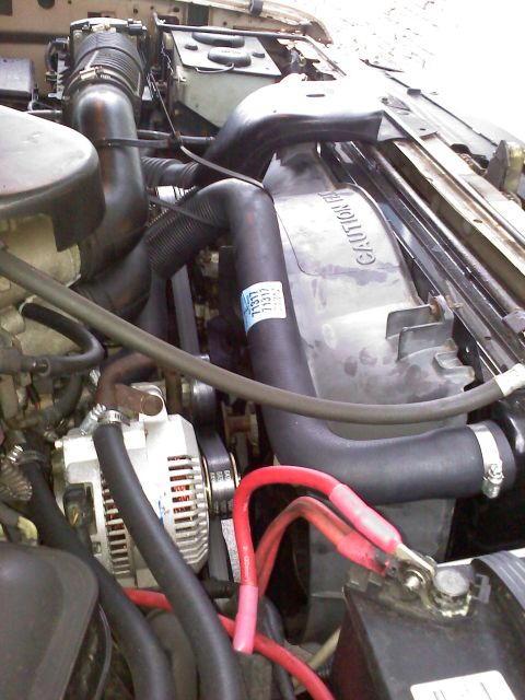 1992 Ford Bronco - Close-up view of an engine bay, showing various components and wiring.