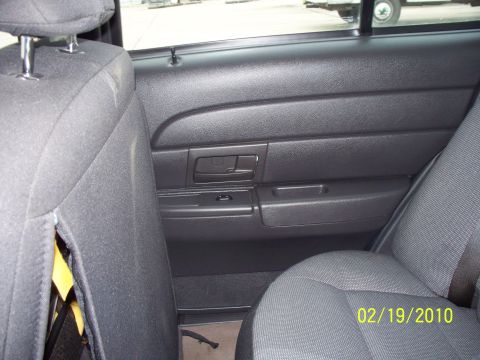 2005 Ford Crown Victoria - Interior view of the rear passenger door panel and seats, with a visible date stamp.