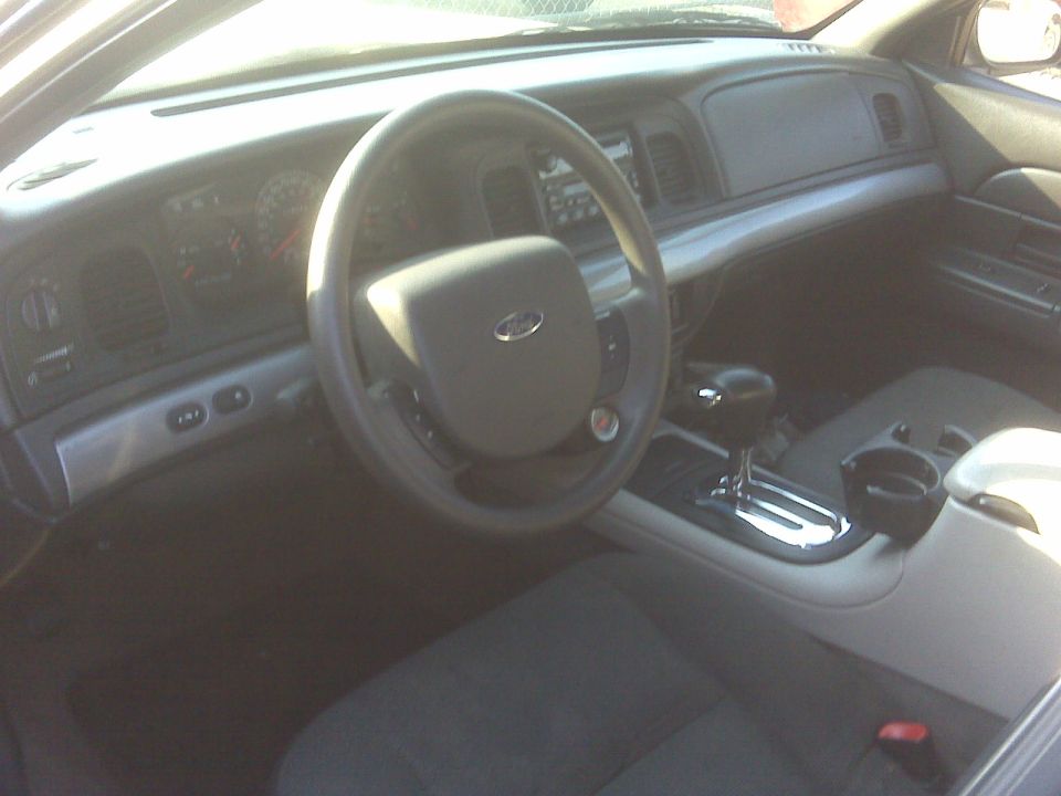 Interior of a 2005 Ford Crown Victoria showing dashboard and steering wheel