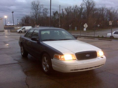 2005 Ford Crown Victoria - This 2005 Ford Crown Victoria features a two-tone paint scheme with a white hood and front bumper.