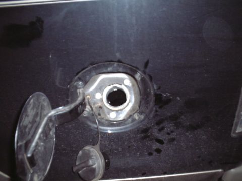 2000 Ford Excursion - The fuel filler neck and surrounding body panel are visible with the fuel door open.