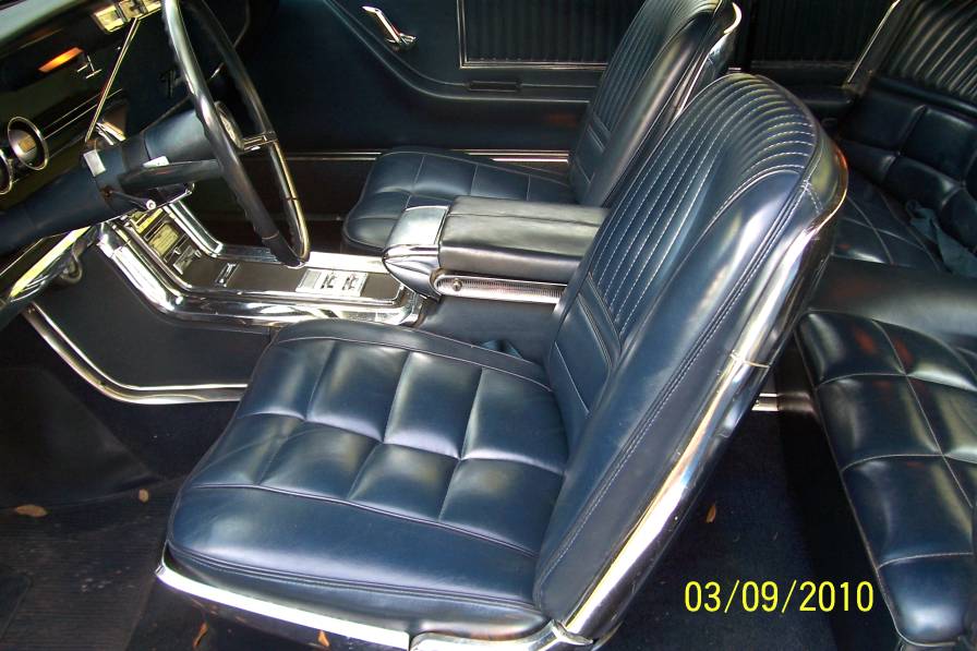 1966 Ford Thunderbird interior with blue vinyl seats and center console