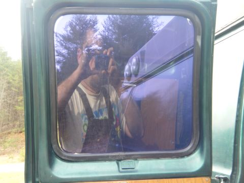 1981 Ford E350 - A reflection shows a person holding a camera in the window of a vehicle, with the Supermotors logo at the bottom.