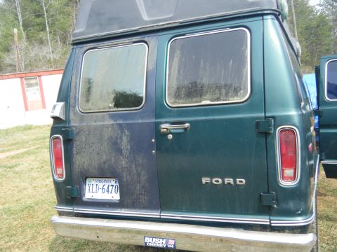 1981 Ford E350 - The rear of a Ford van, showing its taillights and the "FORD" emblem.