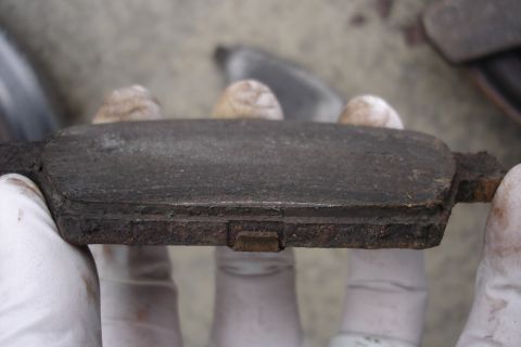 2006 Ford Fusion - This brake pad shows significant wear and is ready for replacement.
