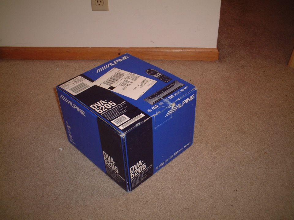 Blue Alpine DVA-5205 DVD player box on carpet